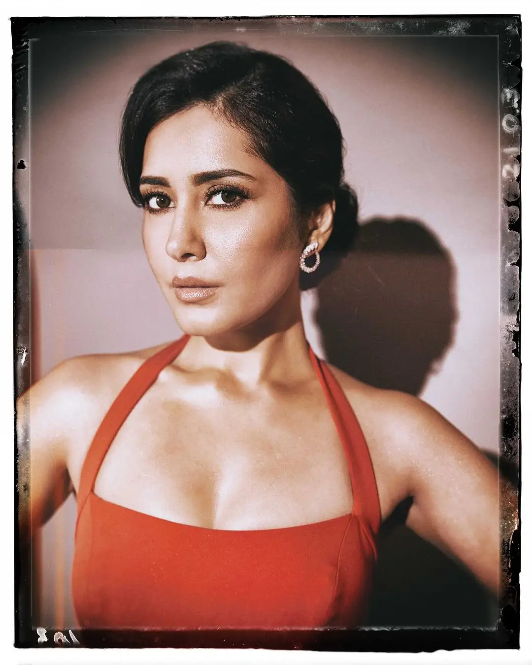 Telugu Girl Raashi Khanna In Sleeveless Orange Gown